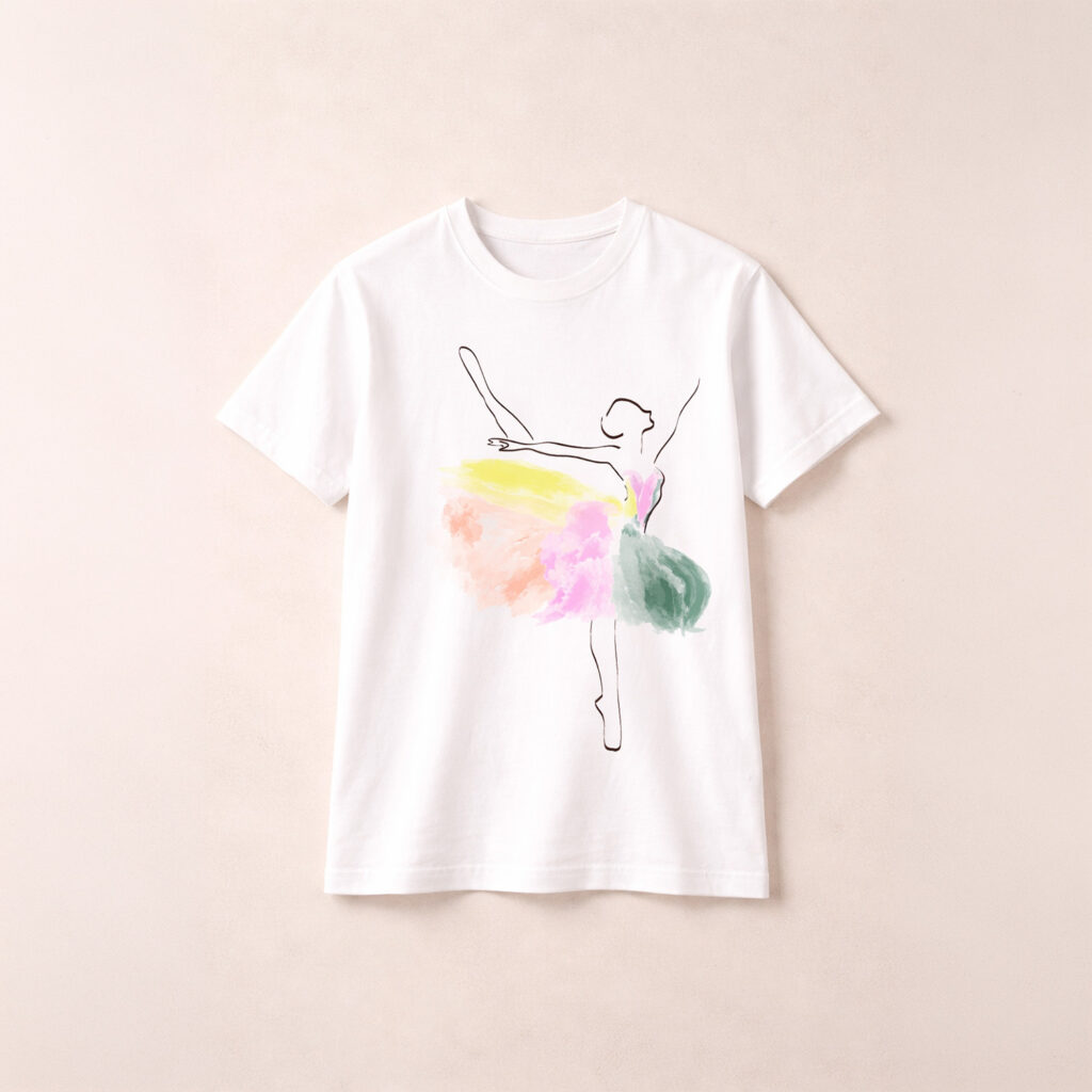 White t-shirt featuring minimalist line-art ballerina with soft pastel watercolor skirt in pink, yellow, and green.
