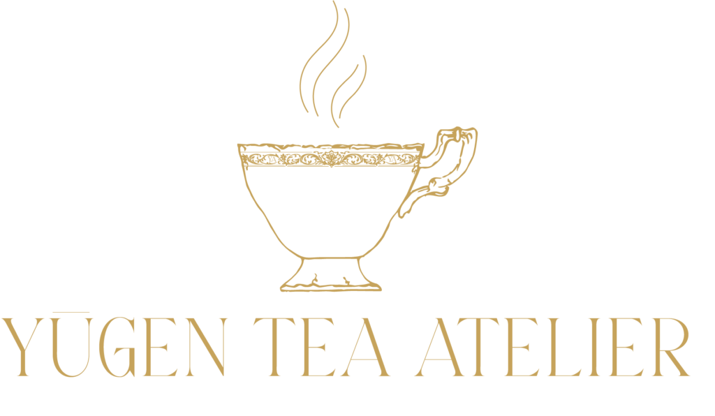 Gold luxury tea logo with ornate teacup and steam, Yūgen Tea Atelier branding